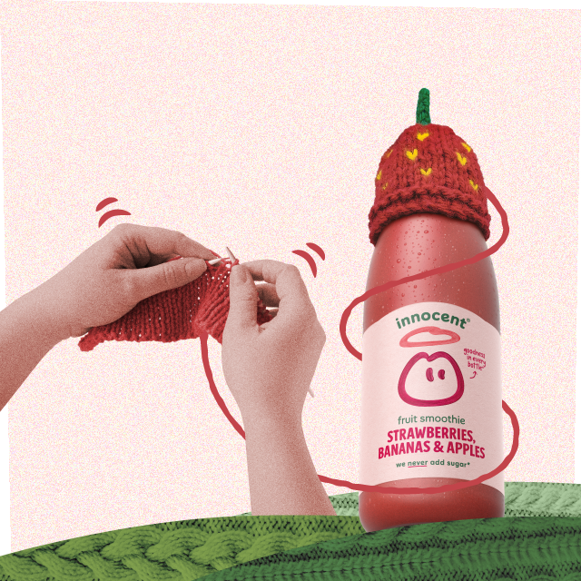 Here's a smoothie bottle with a strawberry hat on. 