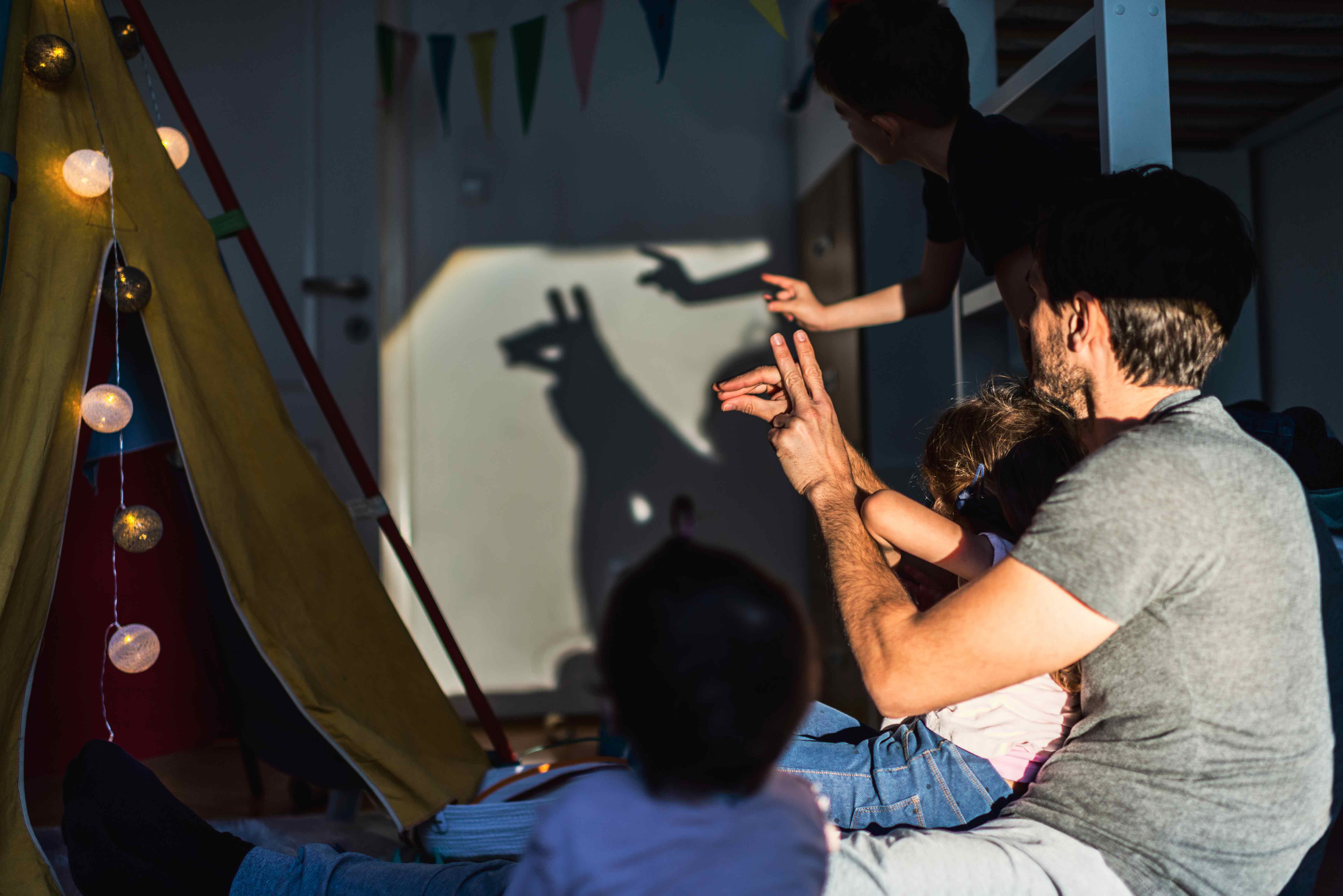 InnocentDrinks, adult and child shadow puppeting