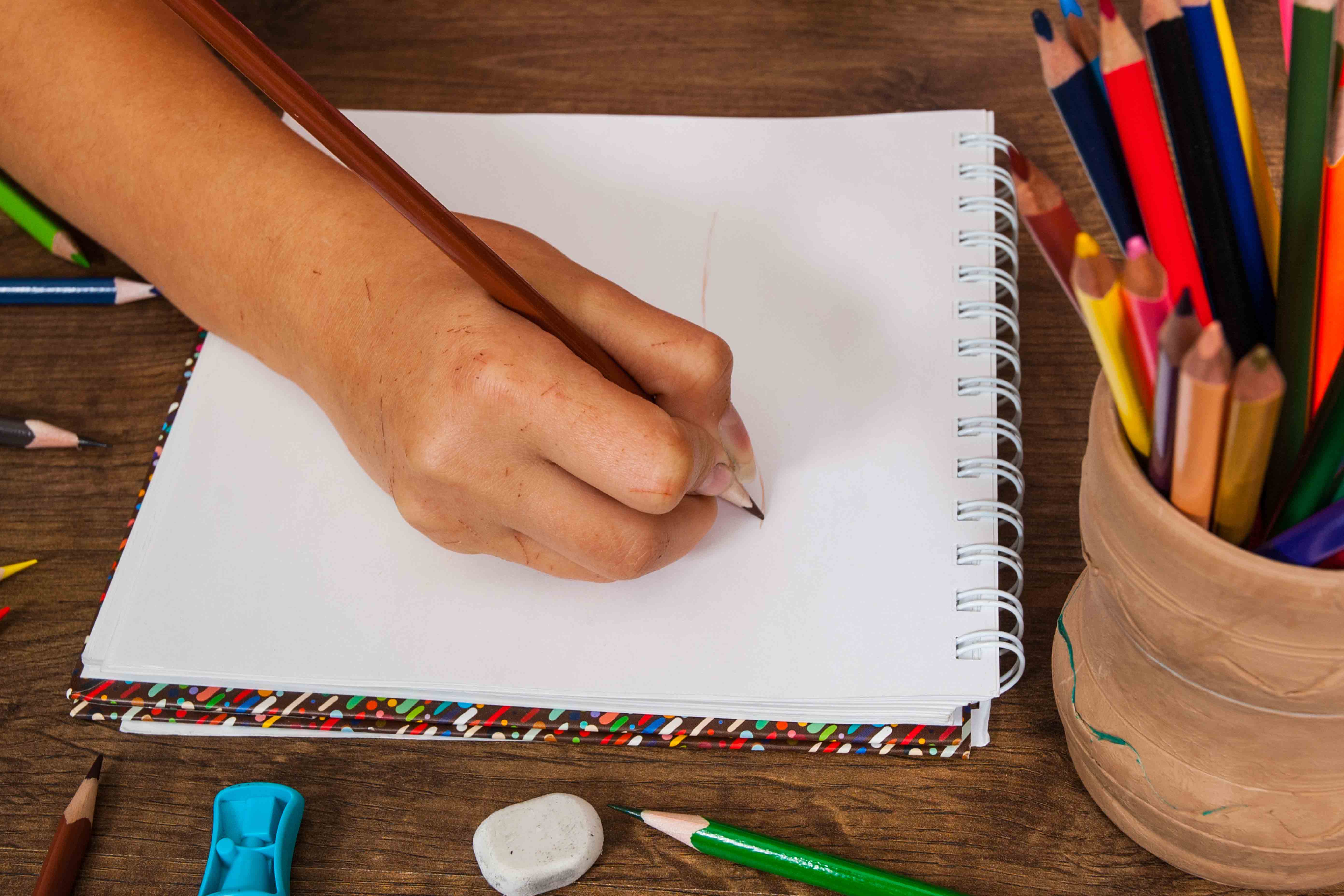 InnocentDrinks, person writing in a notepad
